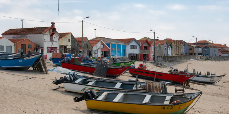 Traditional fishing boats on the beach in Vila Chã